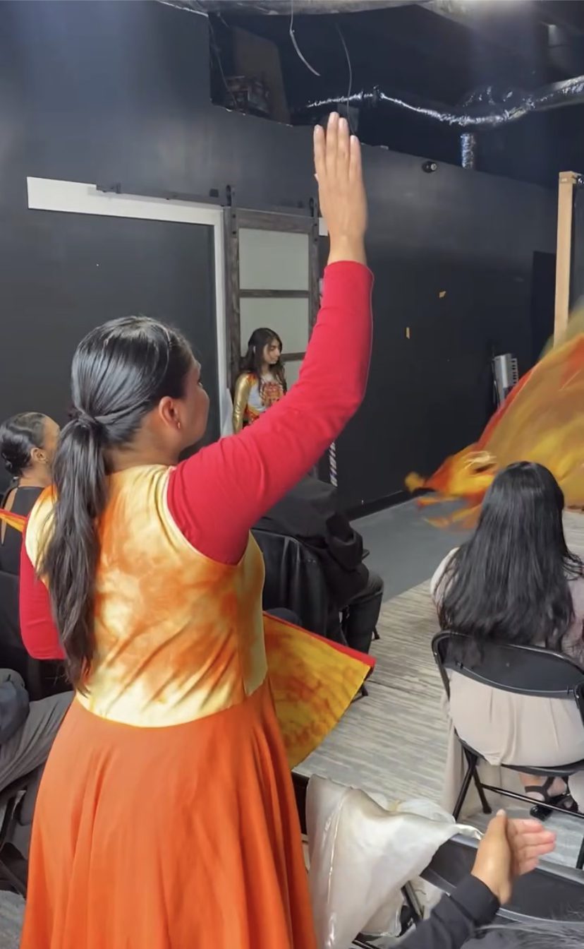 Worship dancer raising hands during praise at LPH Family Church